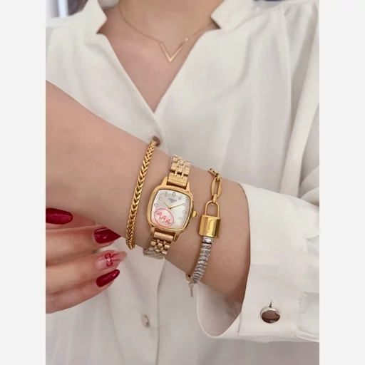 ساعت مچی زنانه تیسوتTISSOT بنداستیل طلایی صفحه مربع سفید ضدآب خاص وجذاب